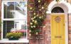 beautiful-yellow-front-door-with-floral-and-exposed-brick