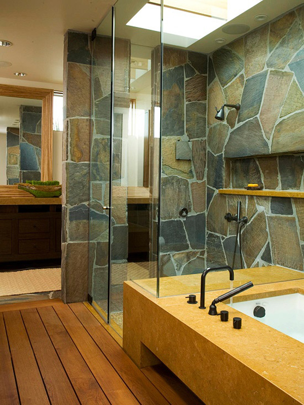 modern stone bathroom with glass doors