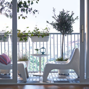 white-ikea-balcony-with-planters | HomeMydesign