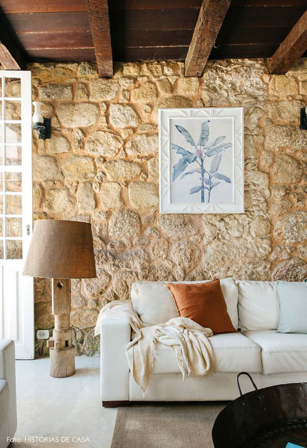 trendy-tropical-living-room-with-stone-walls