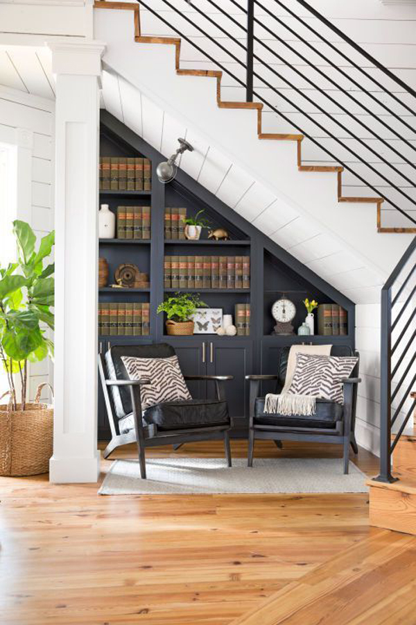 under-stair-bookshelves-with-seating-area