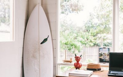 beach-style-home-office-with-surfboard-display