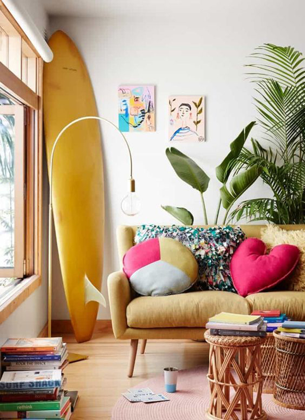 bohemian-coastal-living-room-design-with-surfboard-display