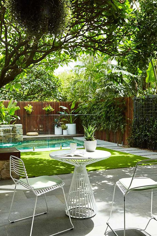 cozy-backyard-pool-with-tropical-decor