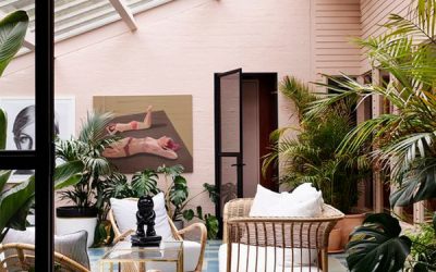 vintage-tropical-sunroom-design-with-pink-accent