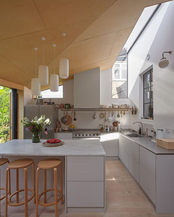 small-kitchen-with-sloped-ceiling-and-skylights