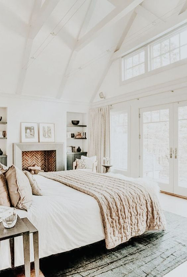 stylish-white-master-bedroom-with-fireplace