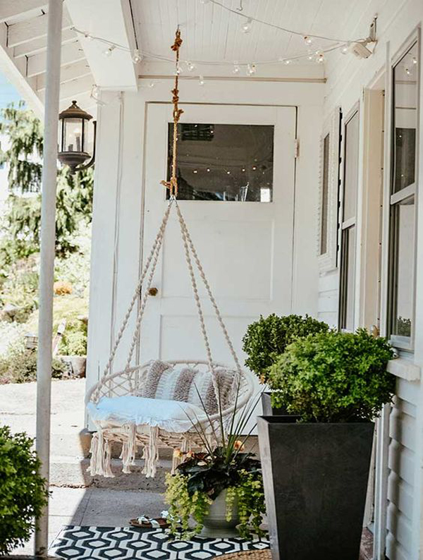 scandinavian-porch-with-hanging-chairs