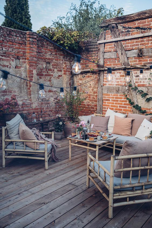 stylish-deck-privacy-ideas-with-exposed-brick-wall