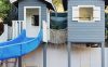 kids-swimming-pool-with-playhouses-and-slides