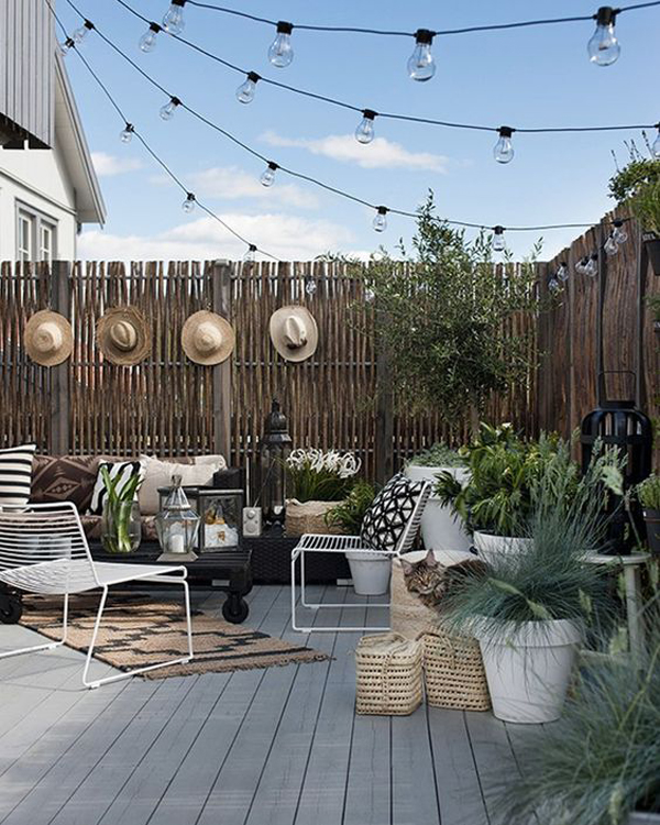 boho-chic-outdoor-lounge-area-with-no-ceiling-string-lights