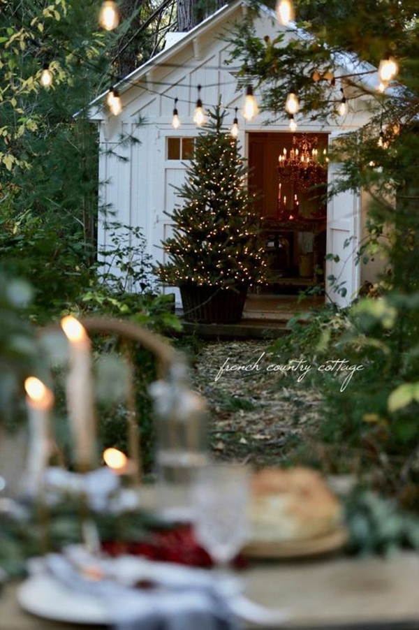 cottage-outdoor-dining-space-with-sparkling-christmas-trees