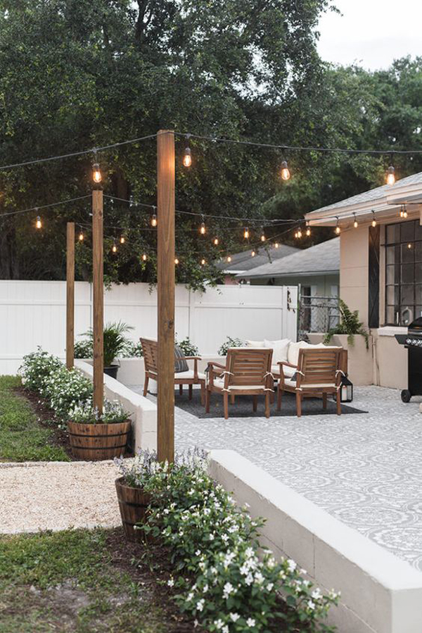 outdoor-living-room-with-wood-bistro-stand-lighting