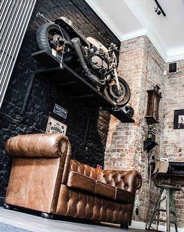 industrial-man-cave-with-hanging-motorcycle-in-the-wall