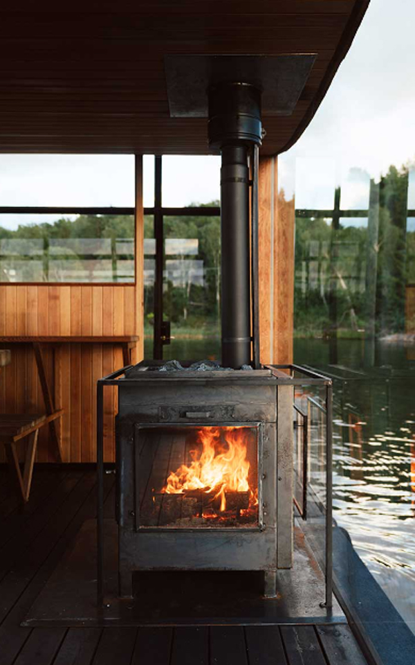 traditional-fireplace-at-floating-sauna
