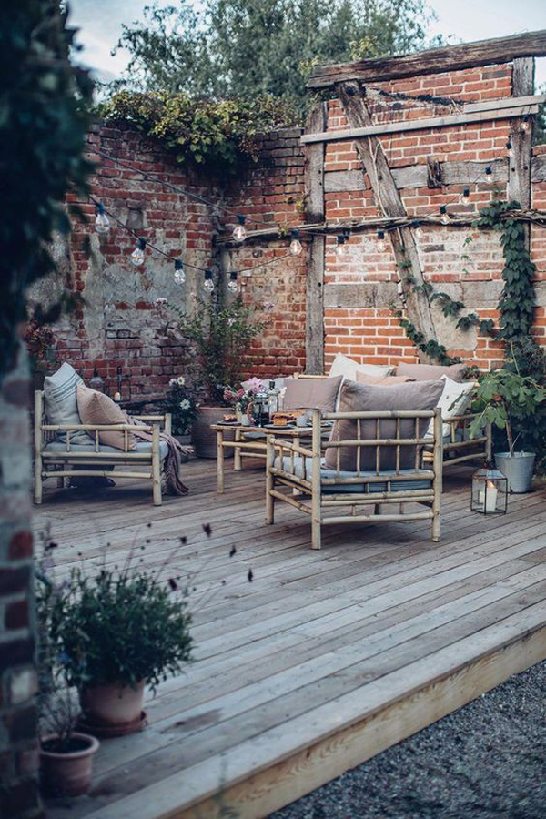 vintage-outdoor-living-space-with-deck-and-exposed-brick