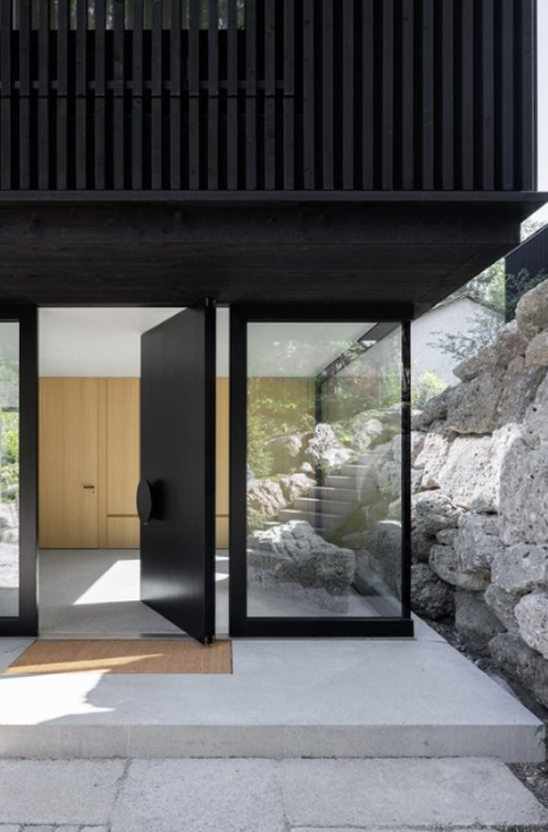 open-front-door-with-stone-material