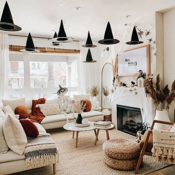 boho-halloween-living-room-with-flying-hats-and-skeleton