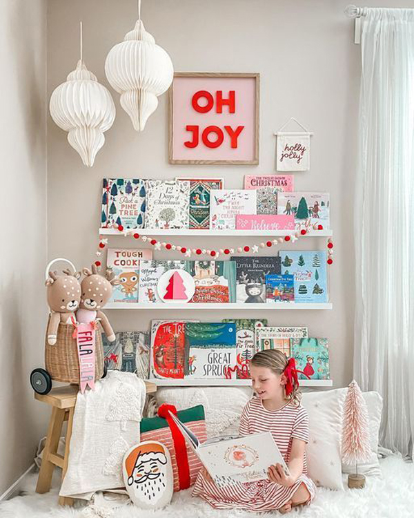 cheerful-kid-reading-floor-with-christmas-theme