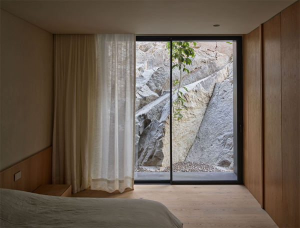 cozy-bedroom-with-stone-ground-exposed