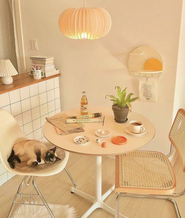 tiny-apartment-dining-area-with-rattan-chair