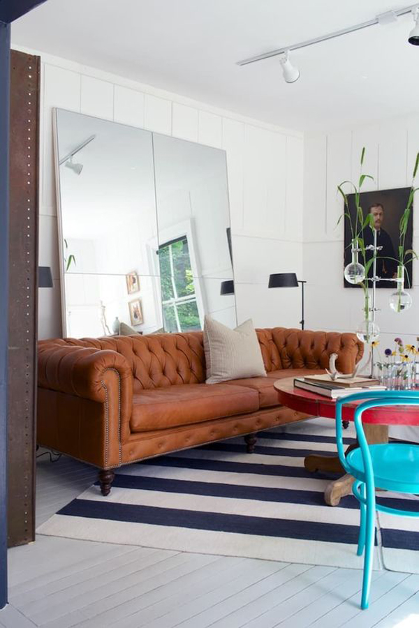 victorian-style-living-room-with-oversized-floor-mirror