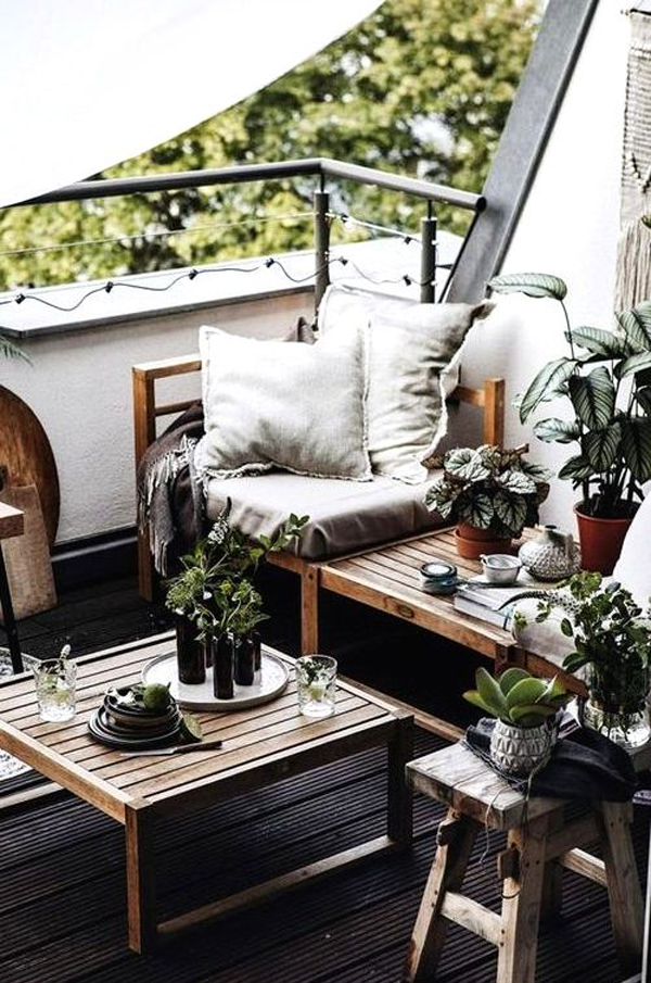 cozy scandinavian balcony design with wooden bench