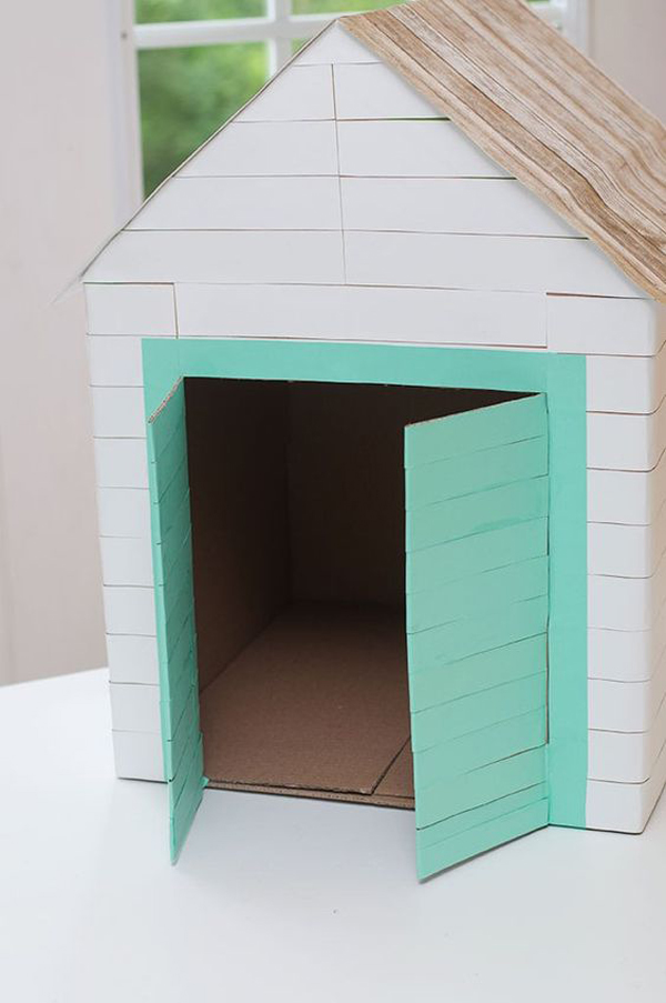 holiday inspired cardboard dog house with beach accent