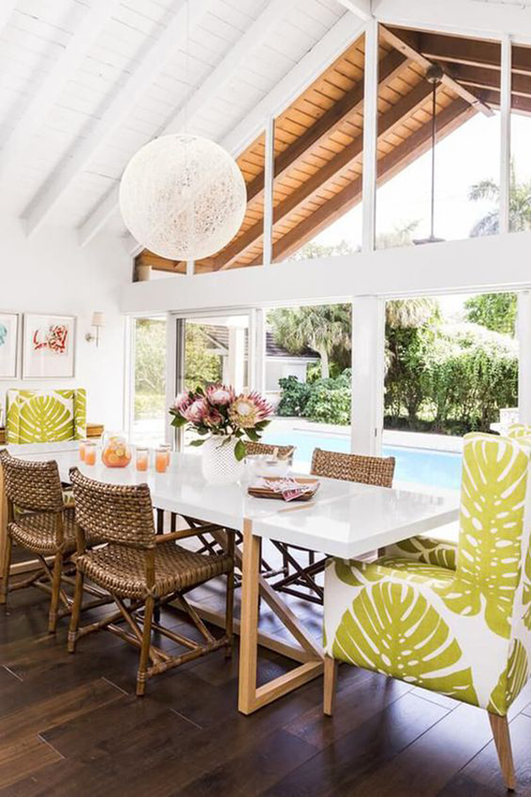 indoor outdoor tropical dining area integrated with pool