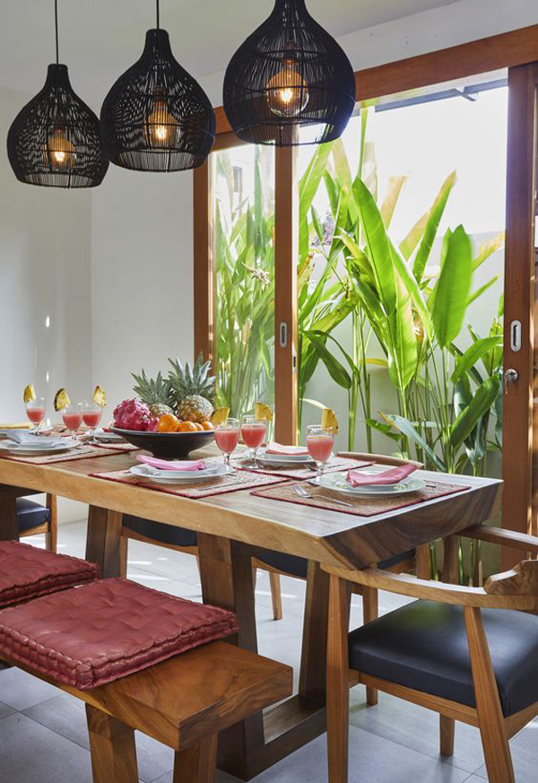 small tropical dining room with woven pendant light